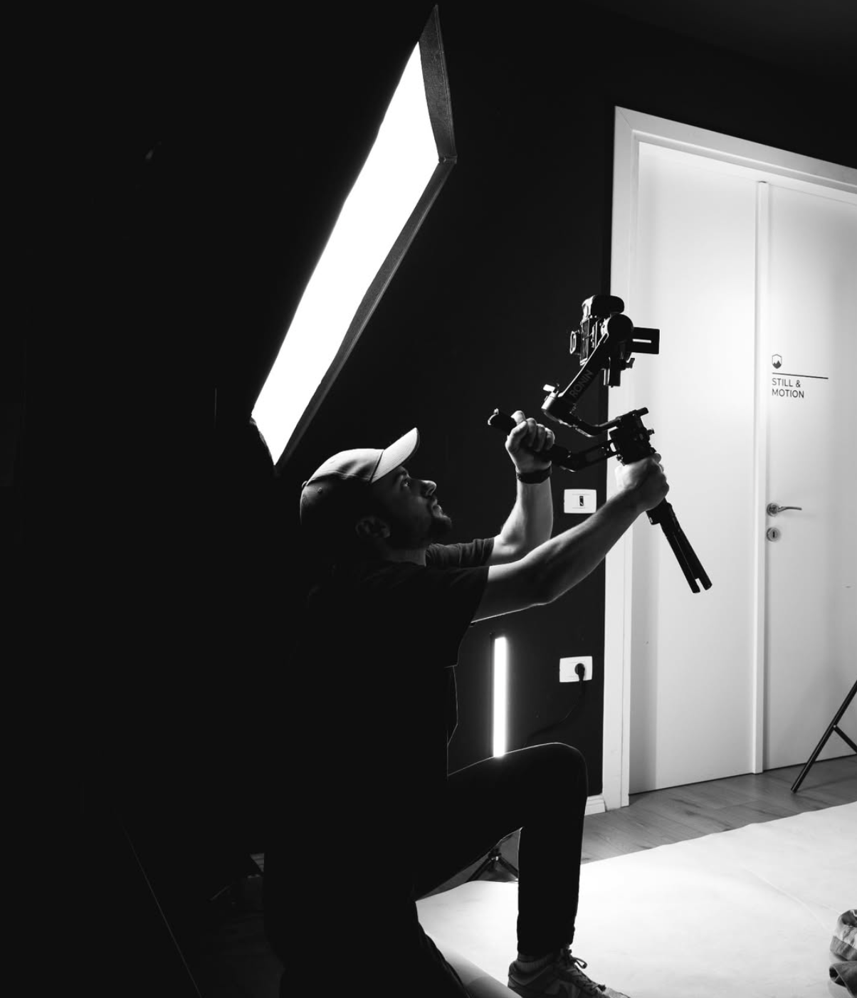 Briken Myzeqari filming with a camera stabilizer in a studio